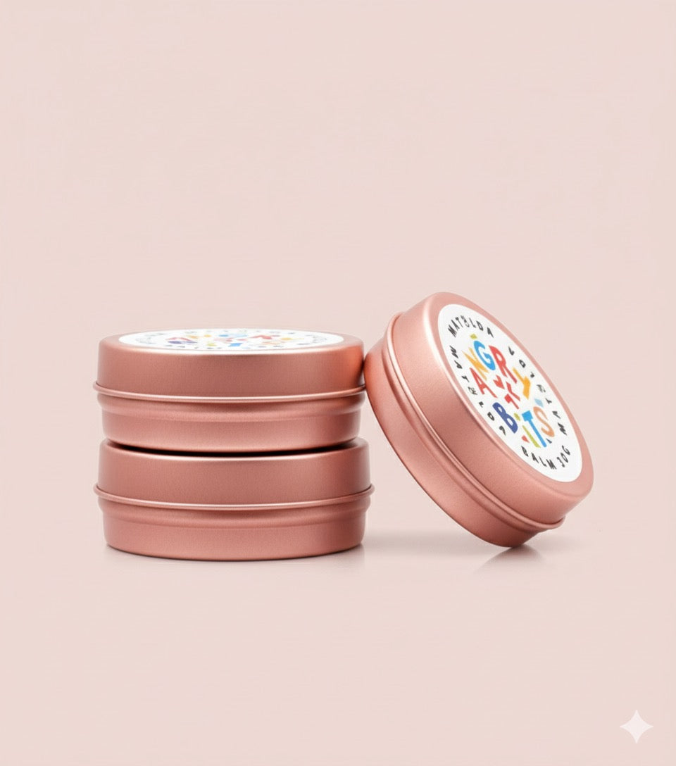 stacked tins of best baby eczema balm for flare-ups and persistent rash
